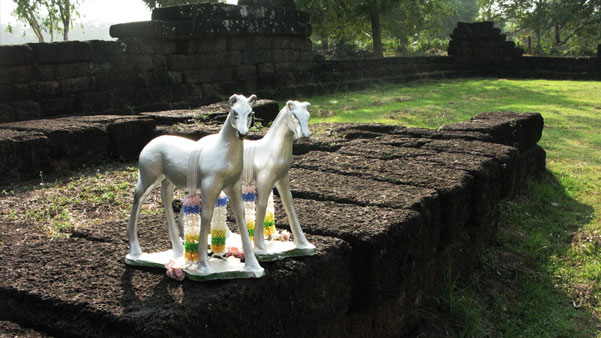 silver horses at temple ruins